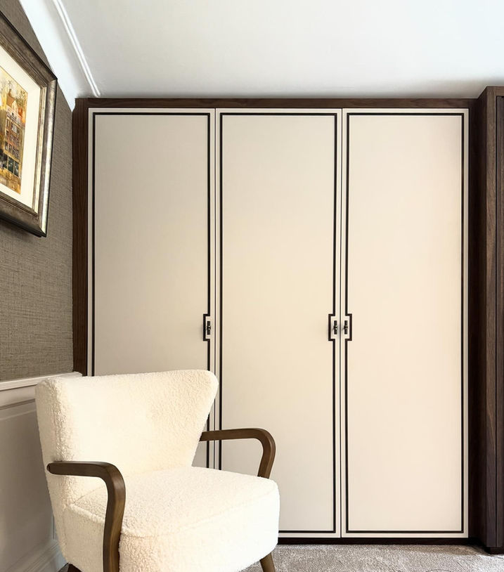 Cream fitted wardrobes with spray finished doors & walnut inlays in Liverpool