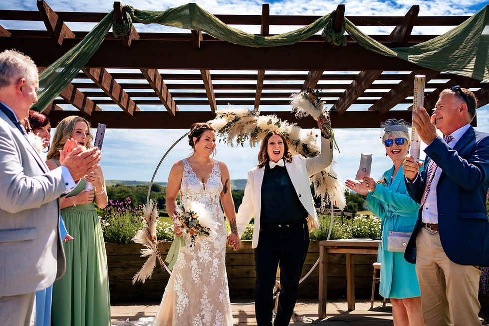 same sex couple at Southlands Barn celebrate