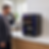 Commercial bean-to-cup coffee machine pouring a fresh cup for an employee in a modern Minneapolis corporate office breakroom