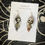 Thumbnail: Creepy Doll Enamel Earrings