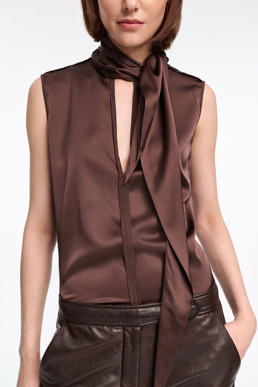 Dorothee Schumacher Sense of Shine Blouse – A sleeveless silk satin blouse in chocolate with a scarf collar for effortless elegance.