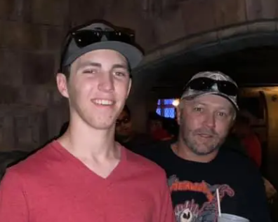 Tyler Robinson pictured with his father.
