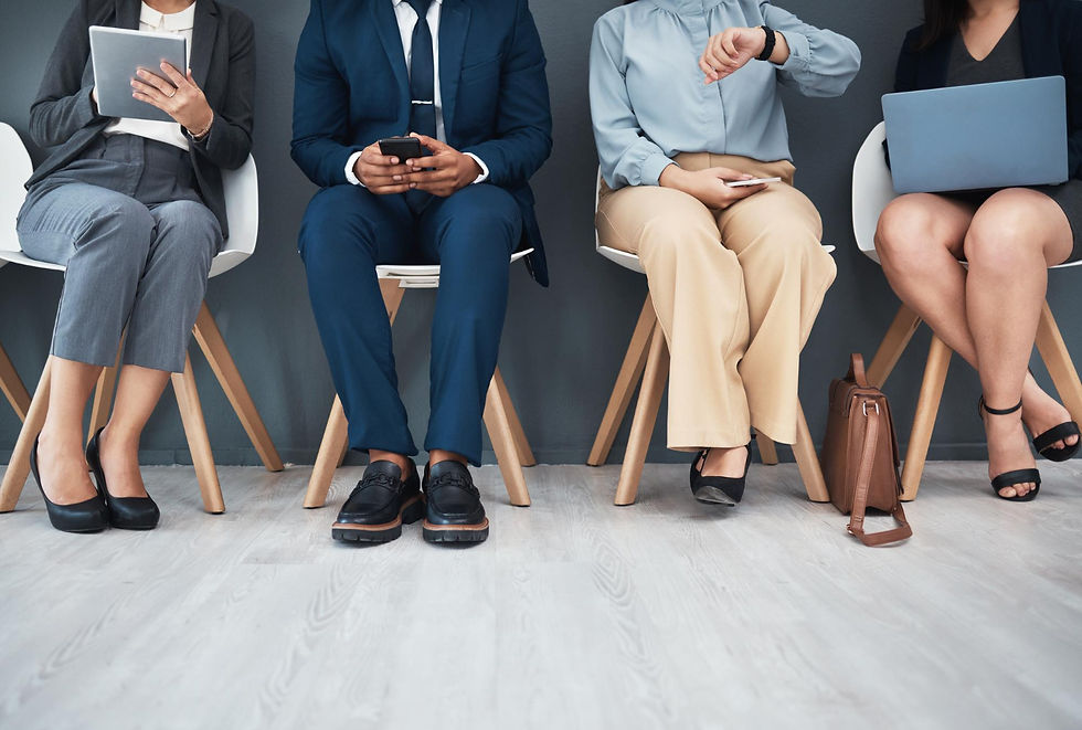 Job interviewees sitting in a waiting room.
