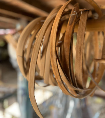 Woven rattan strips hanging to dry