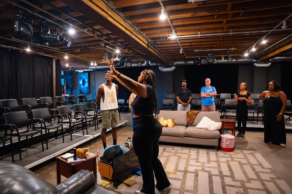 Erica Sutherlin, front, directing cast in rehearsal for Passing Strange at Studio@620. Photo by Tyrese Pope, courtesy of TB Arts Passport.