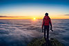photographer-hand-holding-camera-standing-viewpoint-clouds-panorama-viewpoint-sunrise.jpg