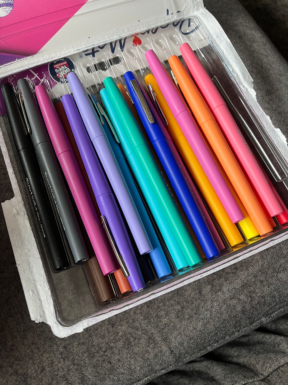 Eye-level view of a journal and pen on a wooden table