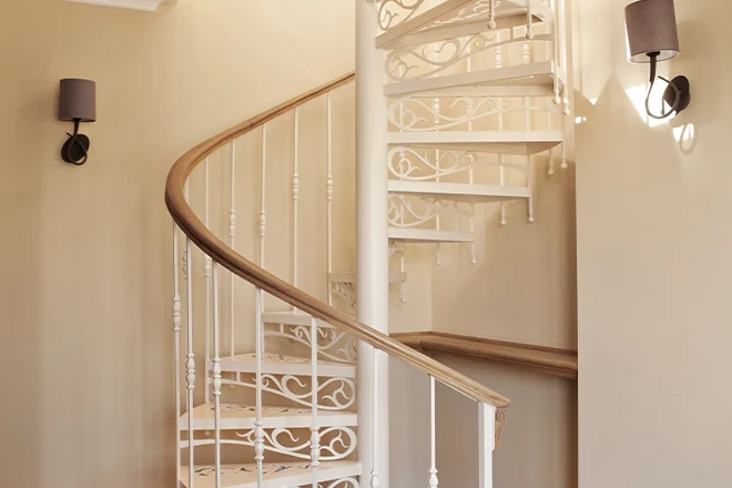 Fancily decorative white spiral staircase
