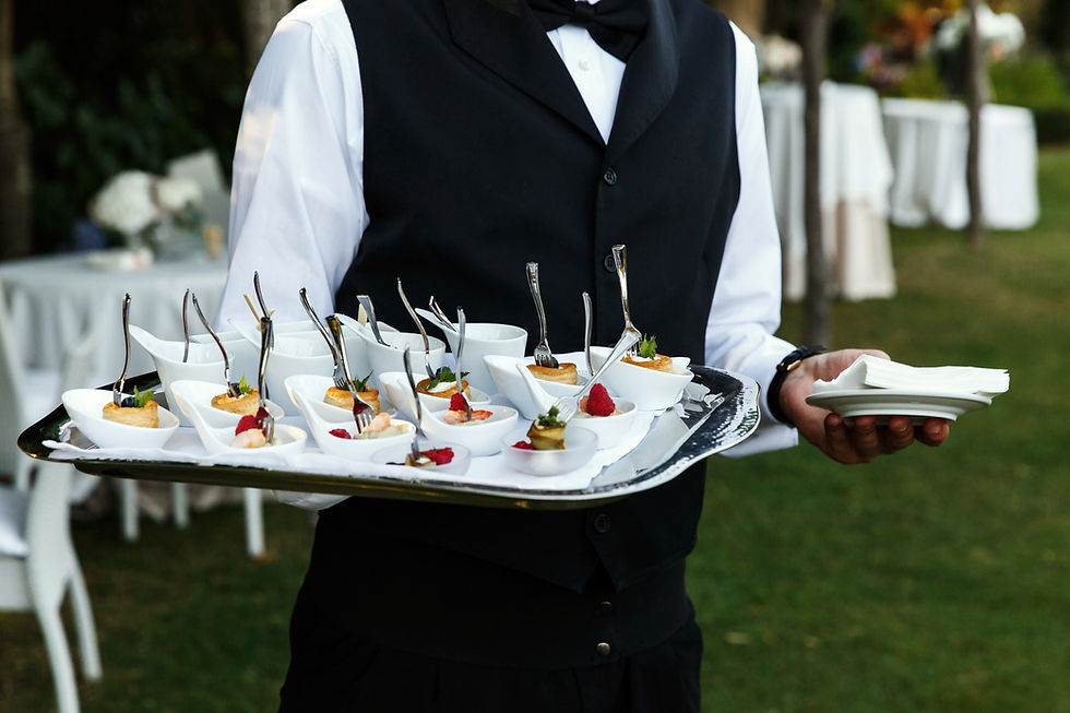 waiter-carries-plate-with-tasty-snacks.jpg