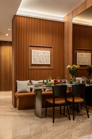 Open dining area in luxury condo Singapore with marble flooring