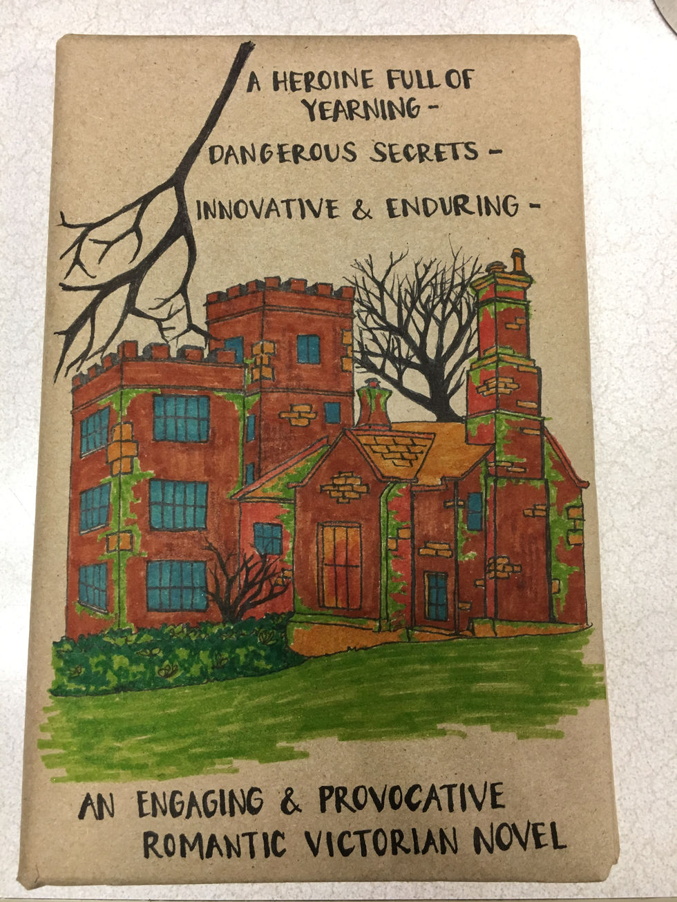 A square brown castle-looking home. A leafless tree behind and a leafless branch in the foreground.