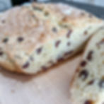 slice of irish soda bread sliced on a cutting board for the catholic feast of st patrick on a table
