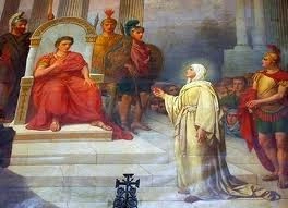 St. Mary Magdalene stands in front of the Emperor holding a red egg. The red egg means that Jesus is risen from the dead.