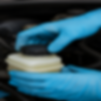Professional brake flush service being performed on a car to remove old fluid