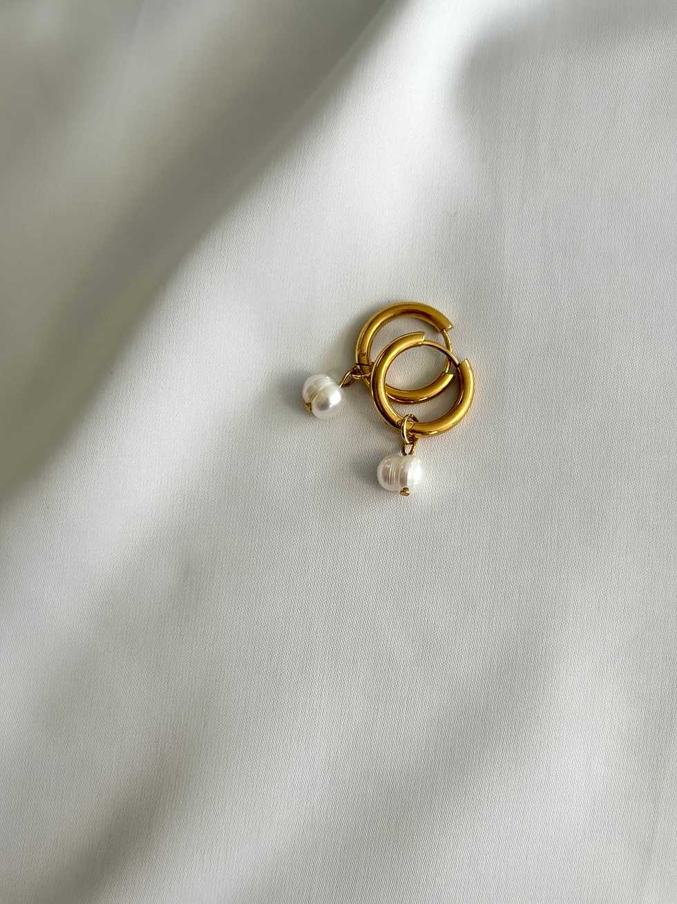Lucia Freshwater Pearl Hoops close-up on white fabric