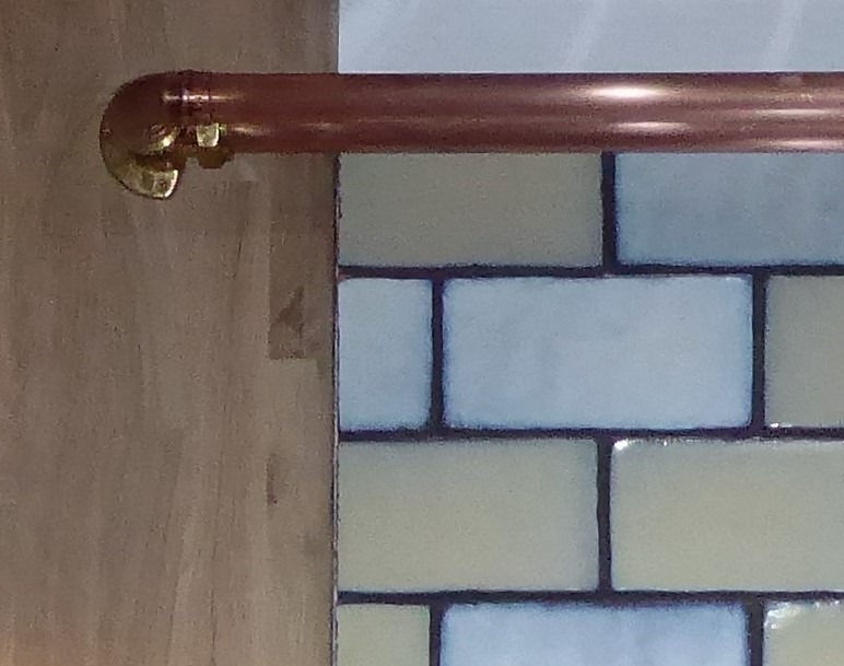 Thumbnail: Copper handrail detail on tiled wall