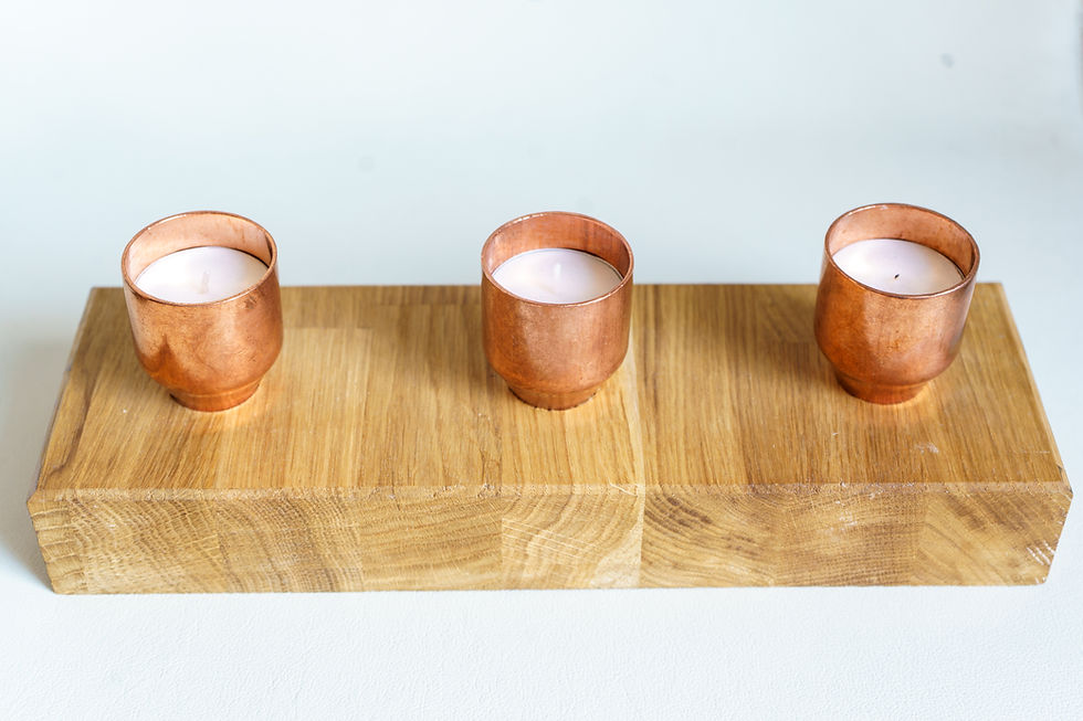 Thumbnail: Copper candle holders on wooden block