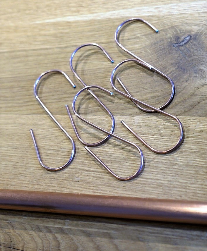 Thumbnail: Five copper S-hooks on wood