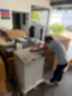 Technician inspecting equipment in a warehouse บริการ