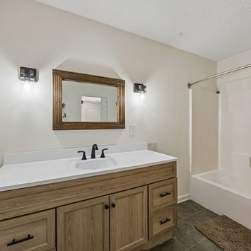 Sink and shower of primary bath at 134 Bowfin Drive Palatka, FL 32177