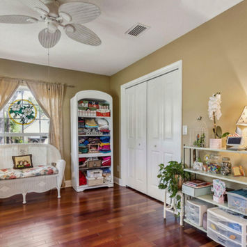 Inviting front parlor with crown molding at 166 Mount Royal Avenue in Crescent City Florida by Margaret Zahner