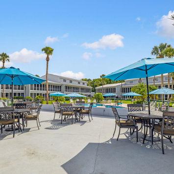 Relaxing outdoor seating area with river proximity at 210 River Bend Place Building B listed by Margaret Zahner