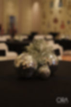 Silver disco ball centerpiece by a luxury wedding planner