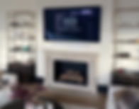 Wall mounted TV over a fireplace, in wall conealed wires