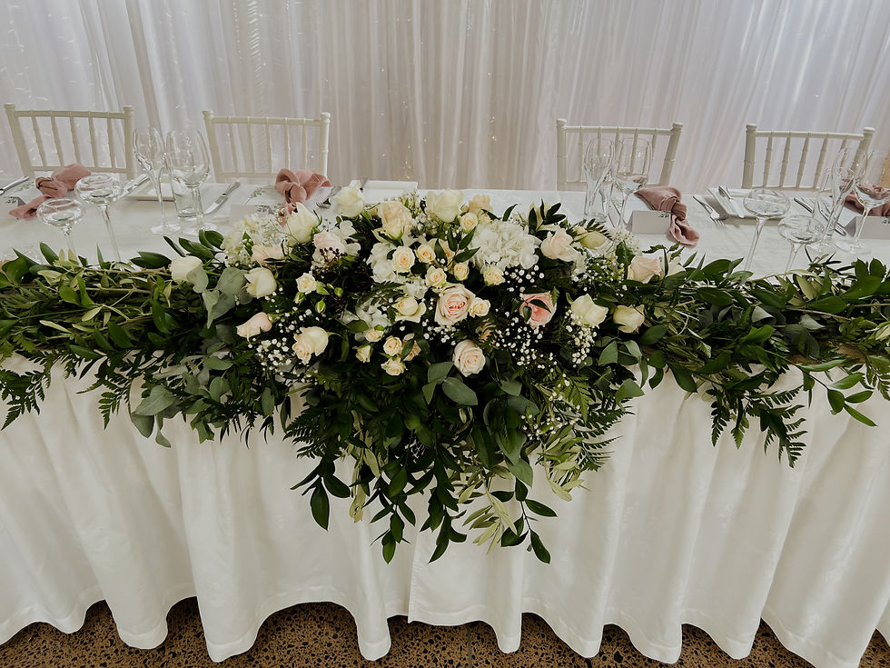 Thumbnail: Head table floral arrangement