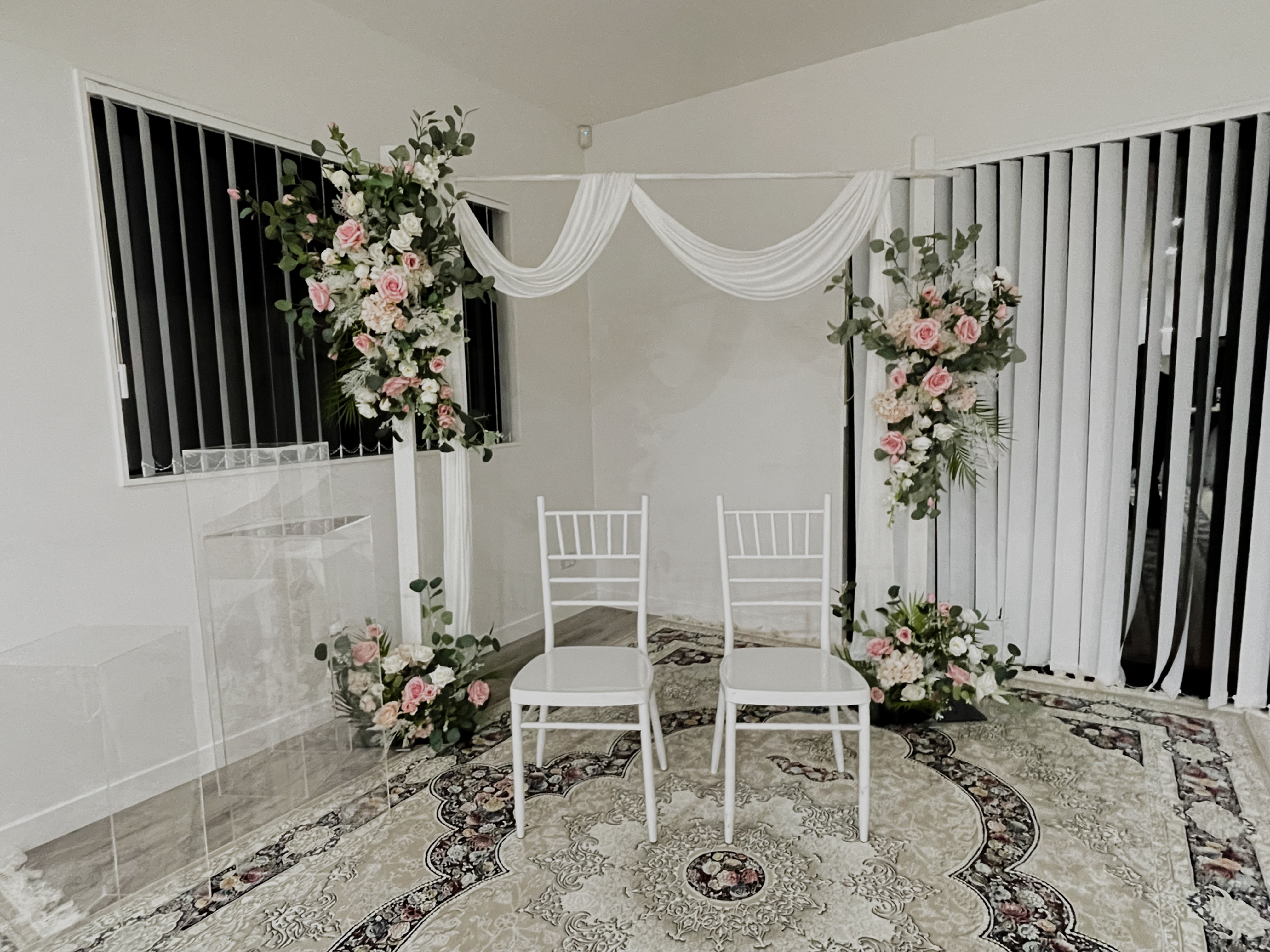 white style arch with floral arrangement