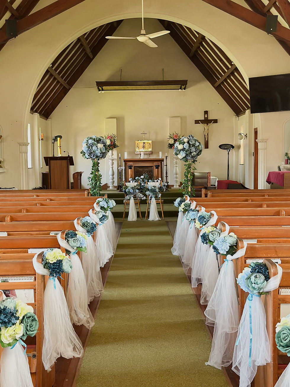 Thumbnail: Church aisle floral plinth and sash