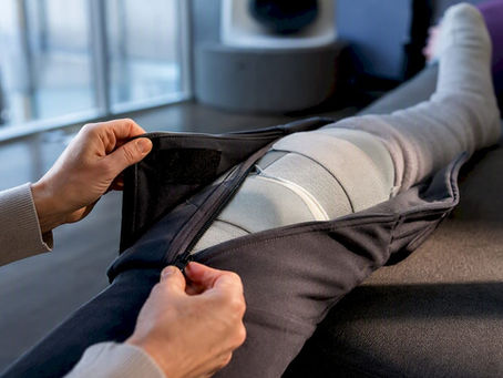 Caregiver adjusting clothing around a leg brace