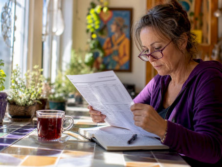 Woman reviewing printed bone health lab results