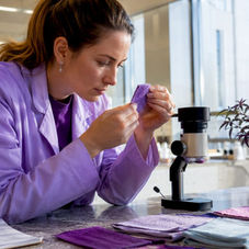 Healthcare professional inspecting breathable fabric
