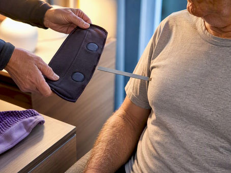 Caregiver measuring magnetic closure distance from chest
