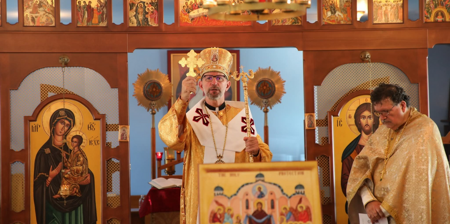 Bishop Artur giving a dismissal blessing