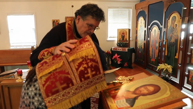 Father Anthony giving absolution