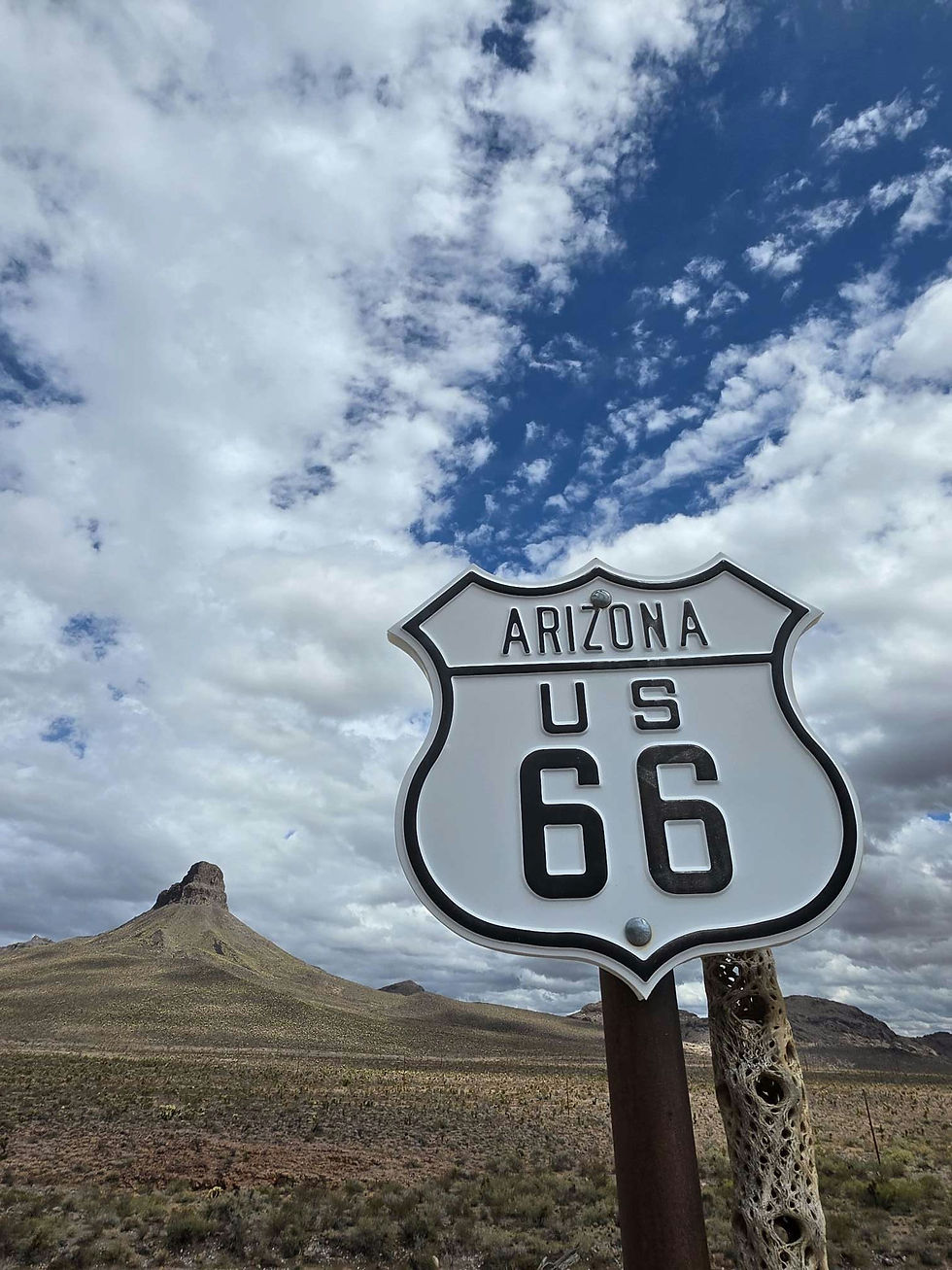 Arizona US Route 66 sign with desert landscape