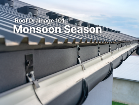 Roof gutter drains water into a puddle, with white text Roof Drainage 101: Monsoon Season on a rainy blue-gray background.