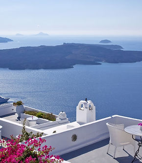 White patio with ocean view; Santorini, Greece, a beautiful travel destination.