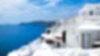 ALT TEXT: Best time to visit Greece showing Santorini Oia whitewashed buildings overlooking the Aegean Sea