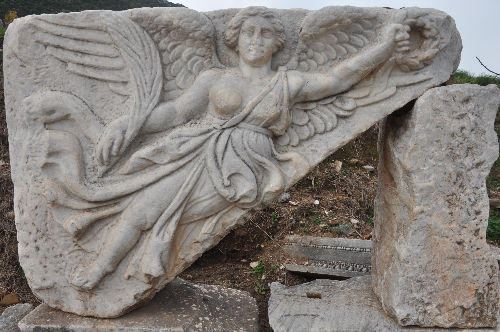 Ancient marble relief of the goddess Nike at Ephesus ruins in Turkey_edited