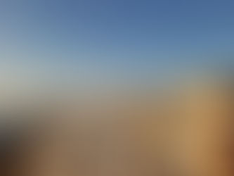 Panoramic view of Oia village in Santorini at sunset with whitewashed houses and the sea