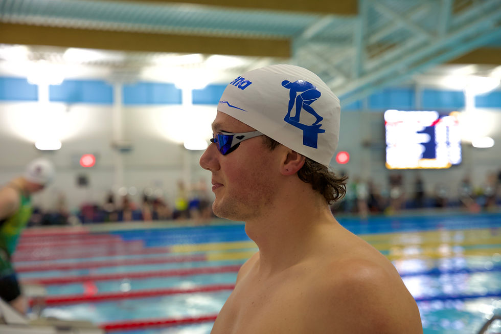 TheSwimsuitGuy wearing the arena Aquaforce Wave Cap in White & Blue