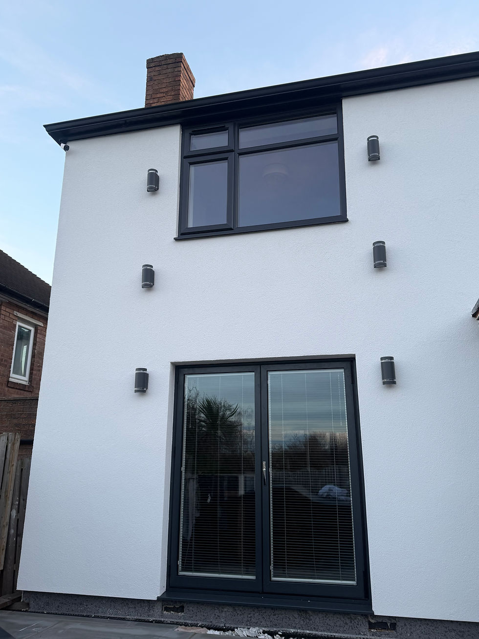 detached house in Sheffield revitalized with a modern white silicone render finish.