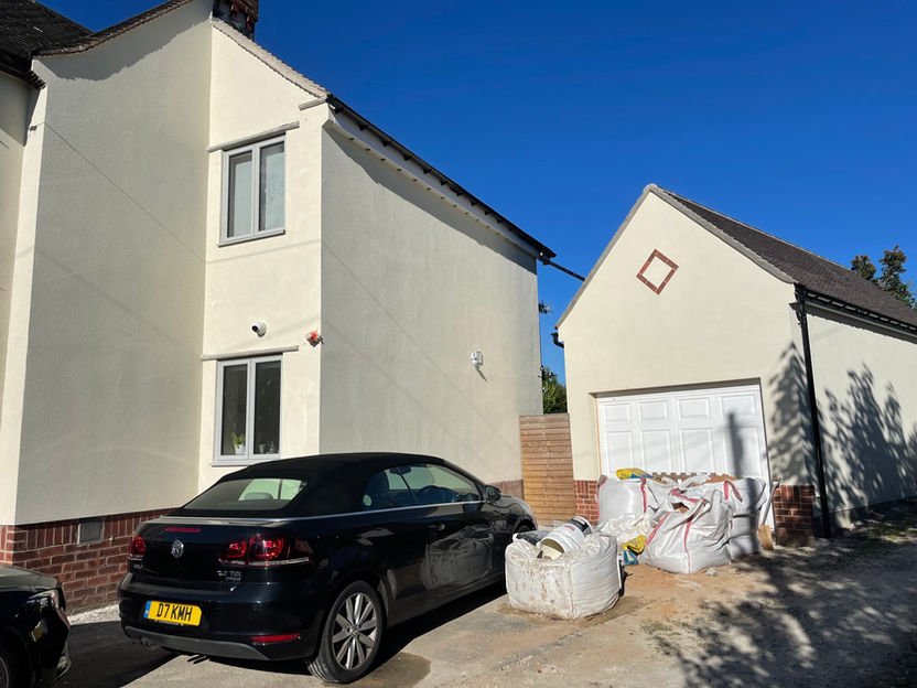 Durable K-Rend Ivory silicone render system used on a house exterior and garage in Chesterfield