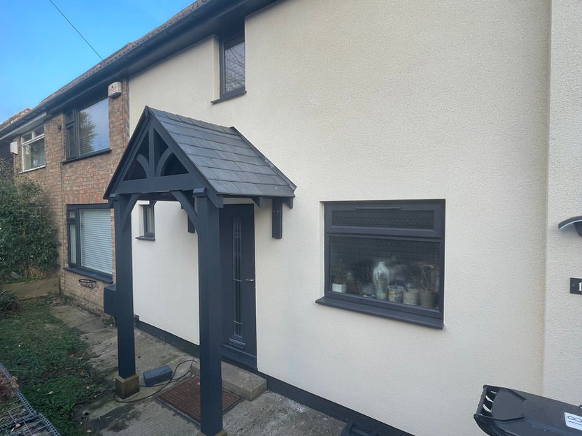 Exterior property renovation featuring a bright white silicone render system.