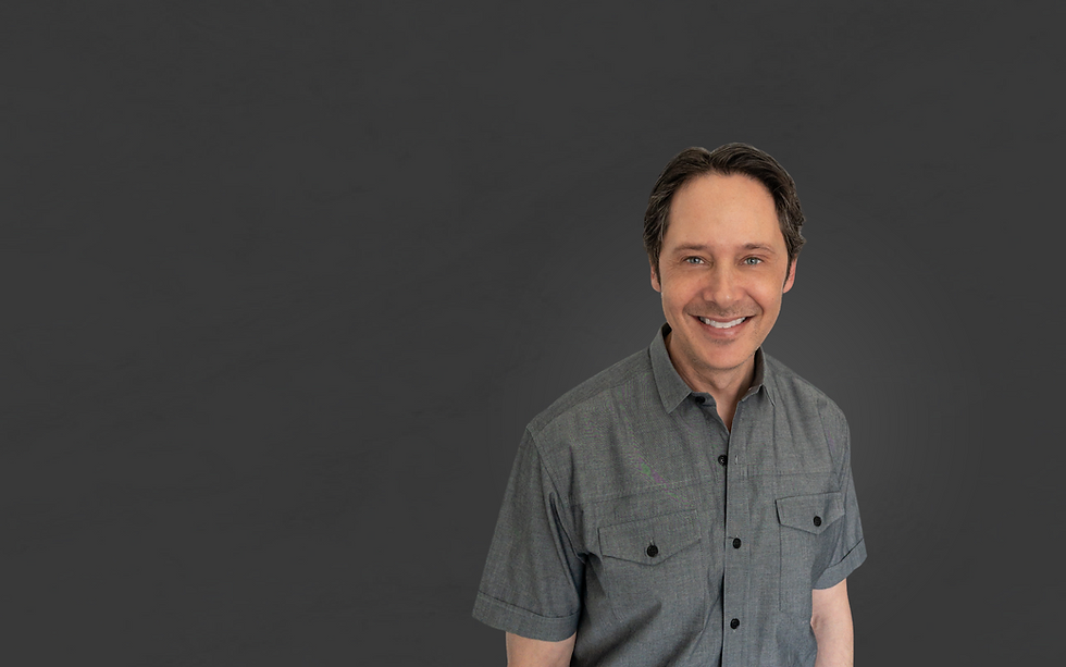 Photo of man against grey background