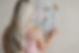 Stephanie standing at wall with moodboard pieces