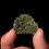 Thumbnail: Vista  frontal fotografía Moldavita alta calidad sujeto por una mano para mostrarlo.